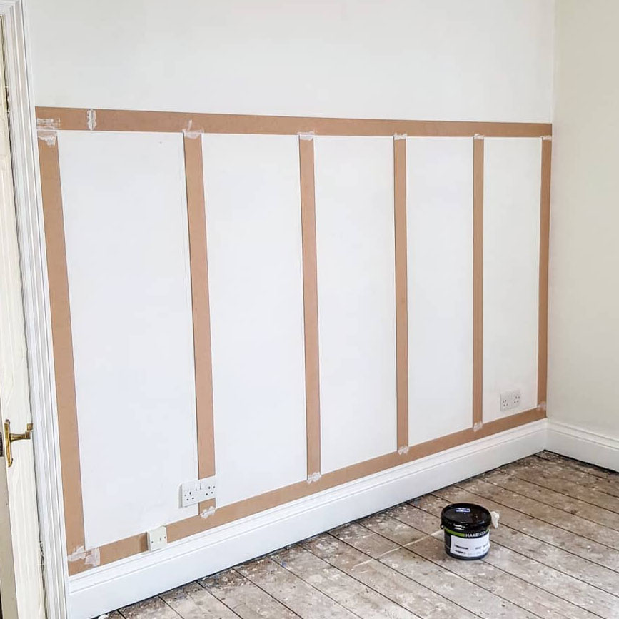 Half installed unpainted wall panelling