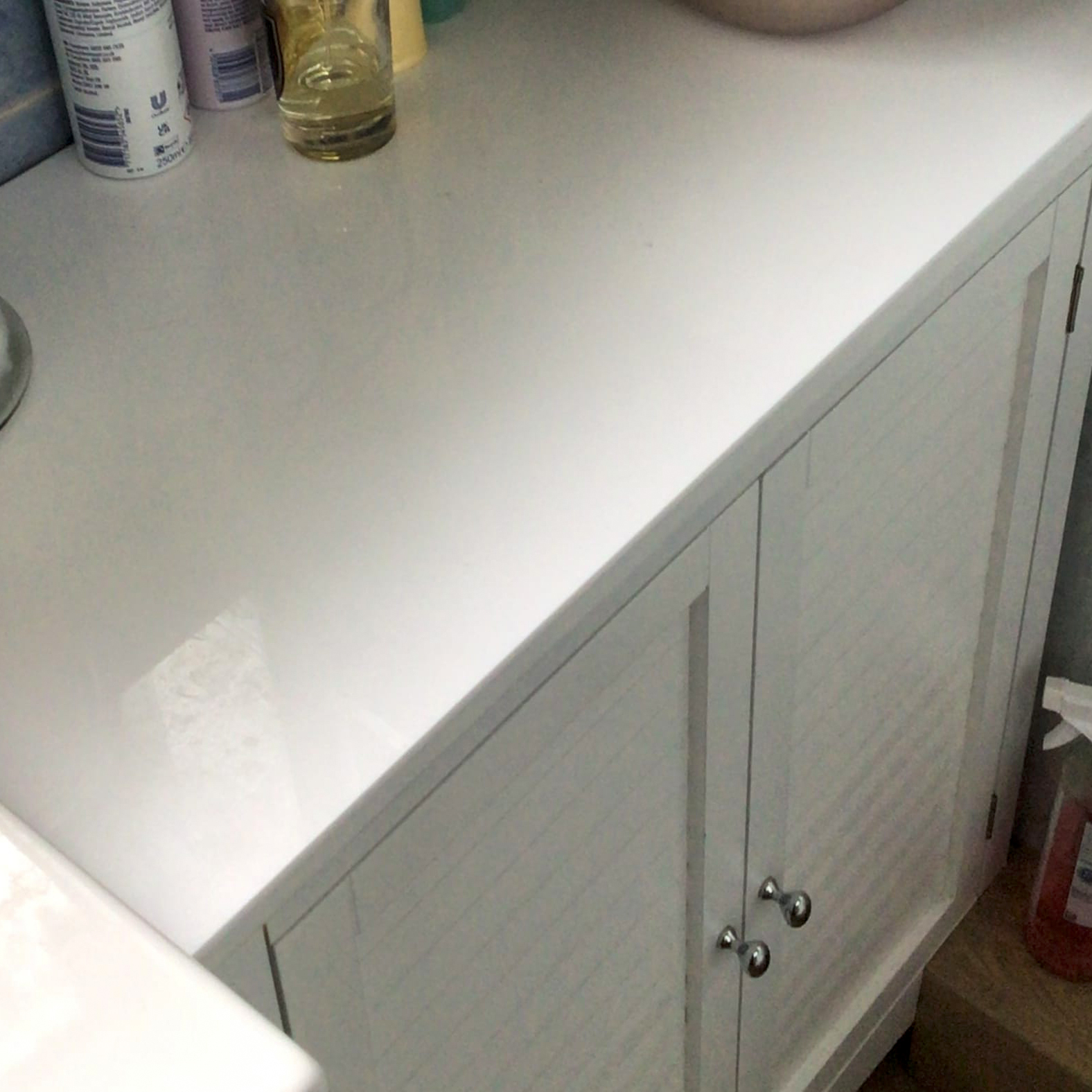 white acrylic table protector on a cupboard