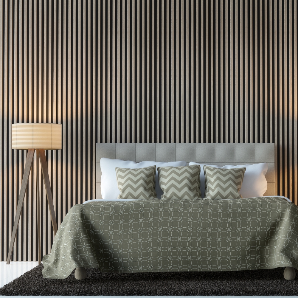 grey slatted wall panel behind a bed and bedside table