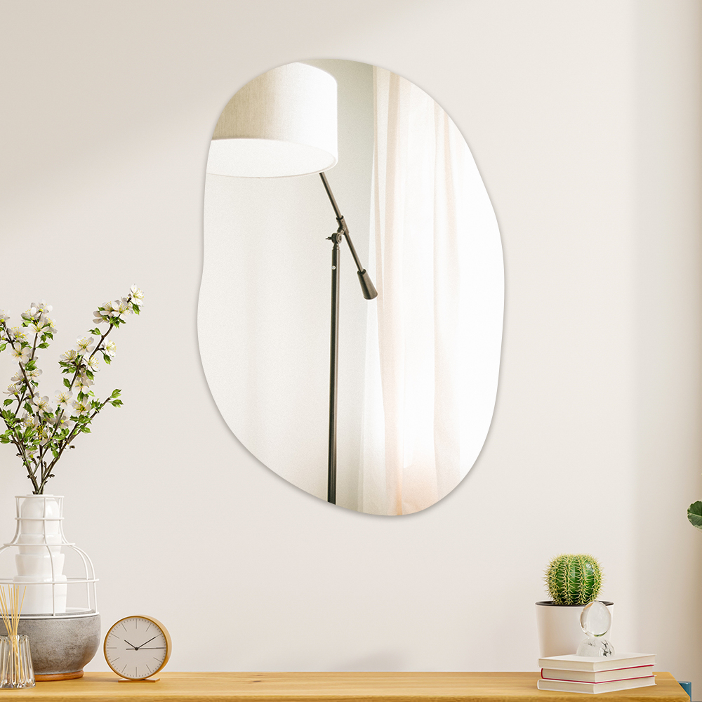 oblong pebble mirror on wall
