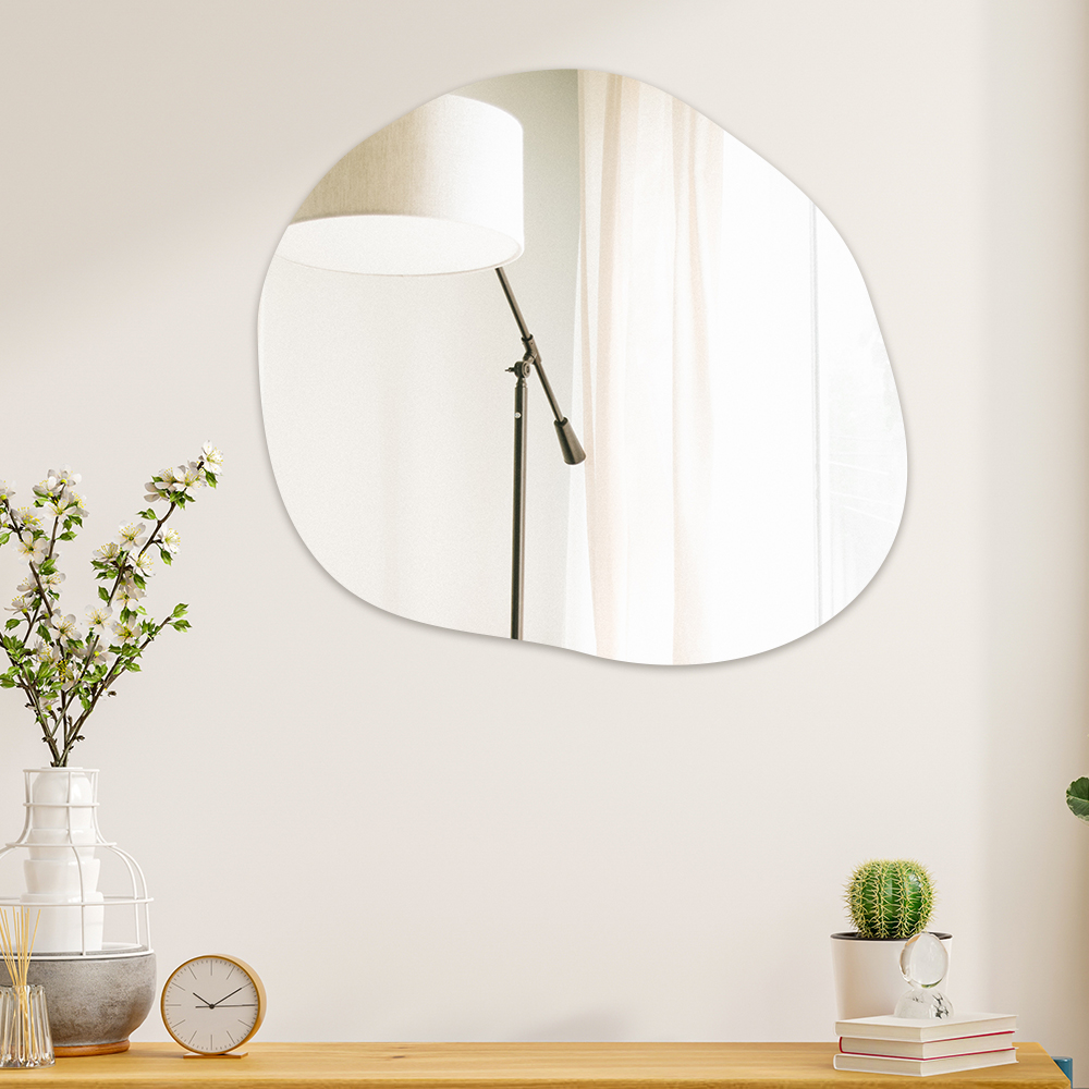 round pebble mirror on wall