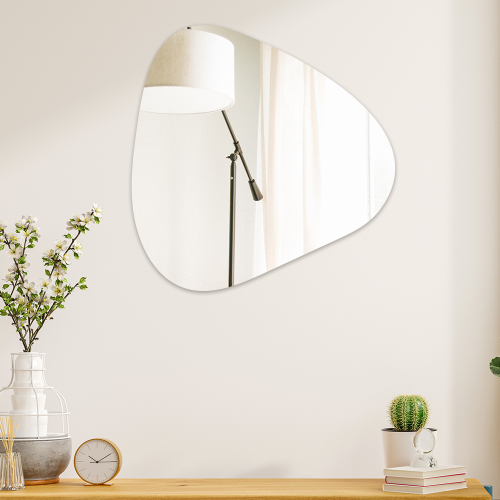 triangular pebble mirror on wall