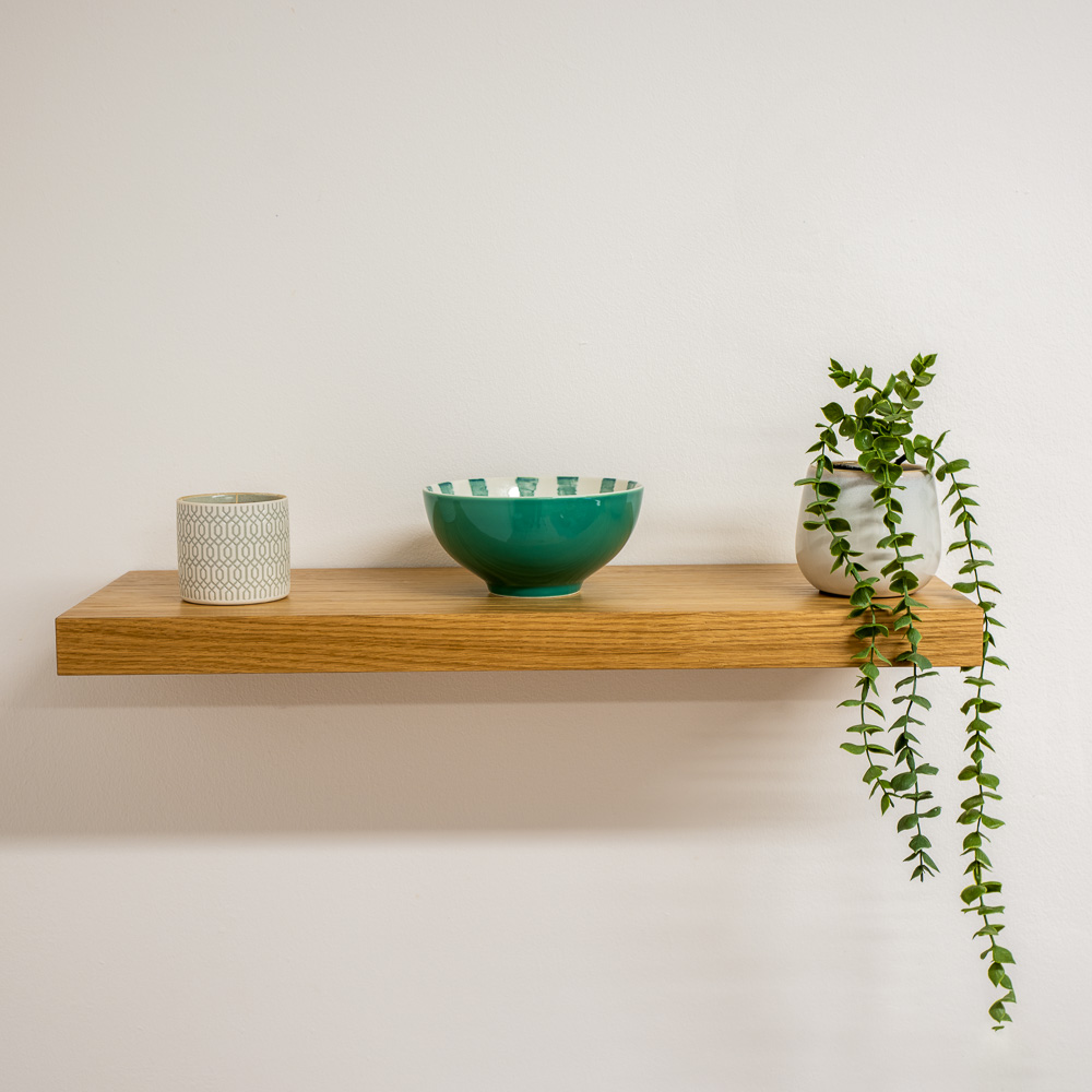 Floating shelf with bowl and plant