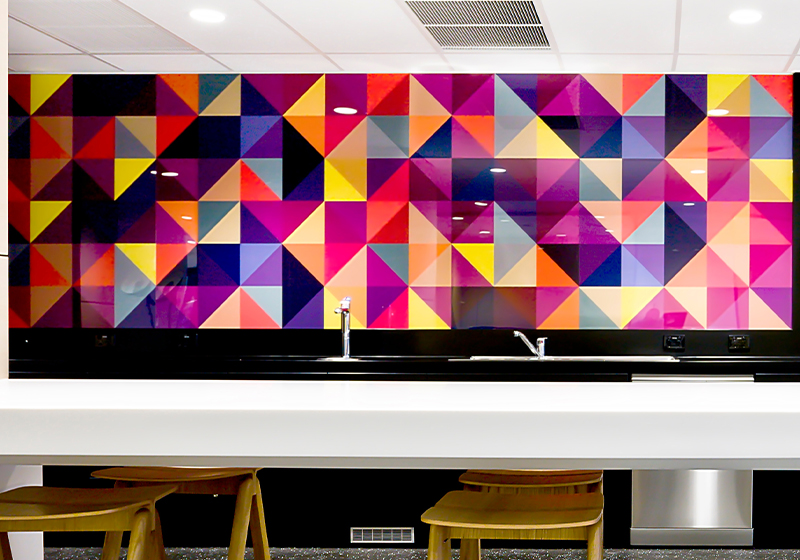 kitchen with a colourful printed splashback