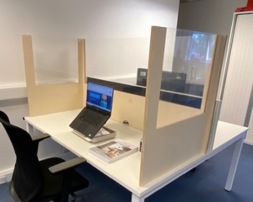 Cube wooden Perspex screen on a desk