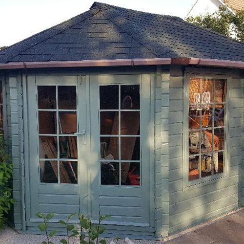 Painted shed with acrylic shed windows