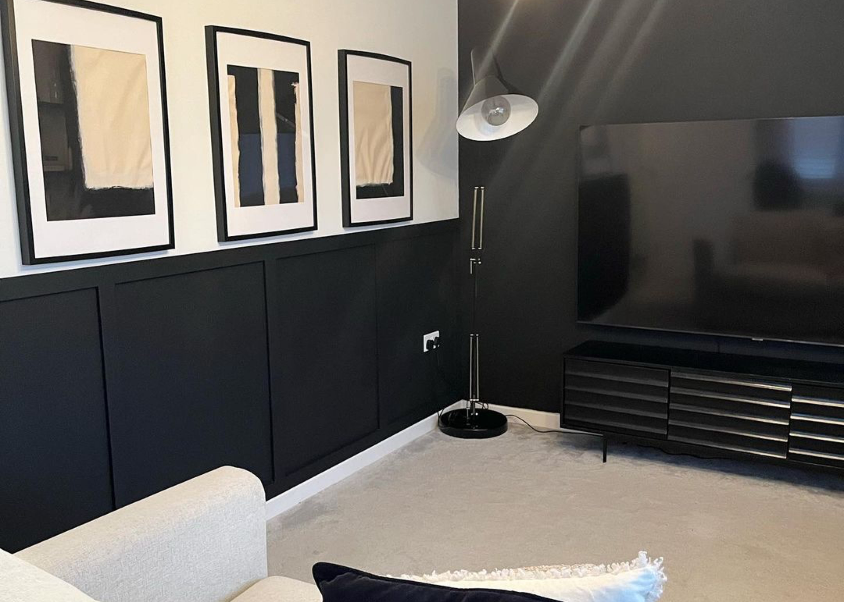 black shaker wall panels in livng room