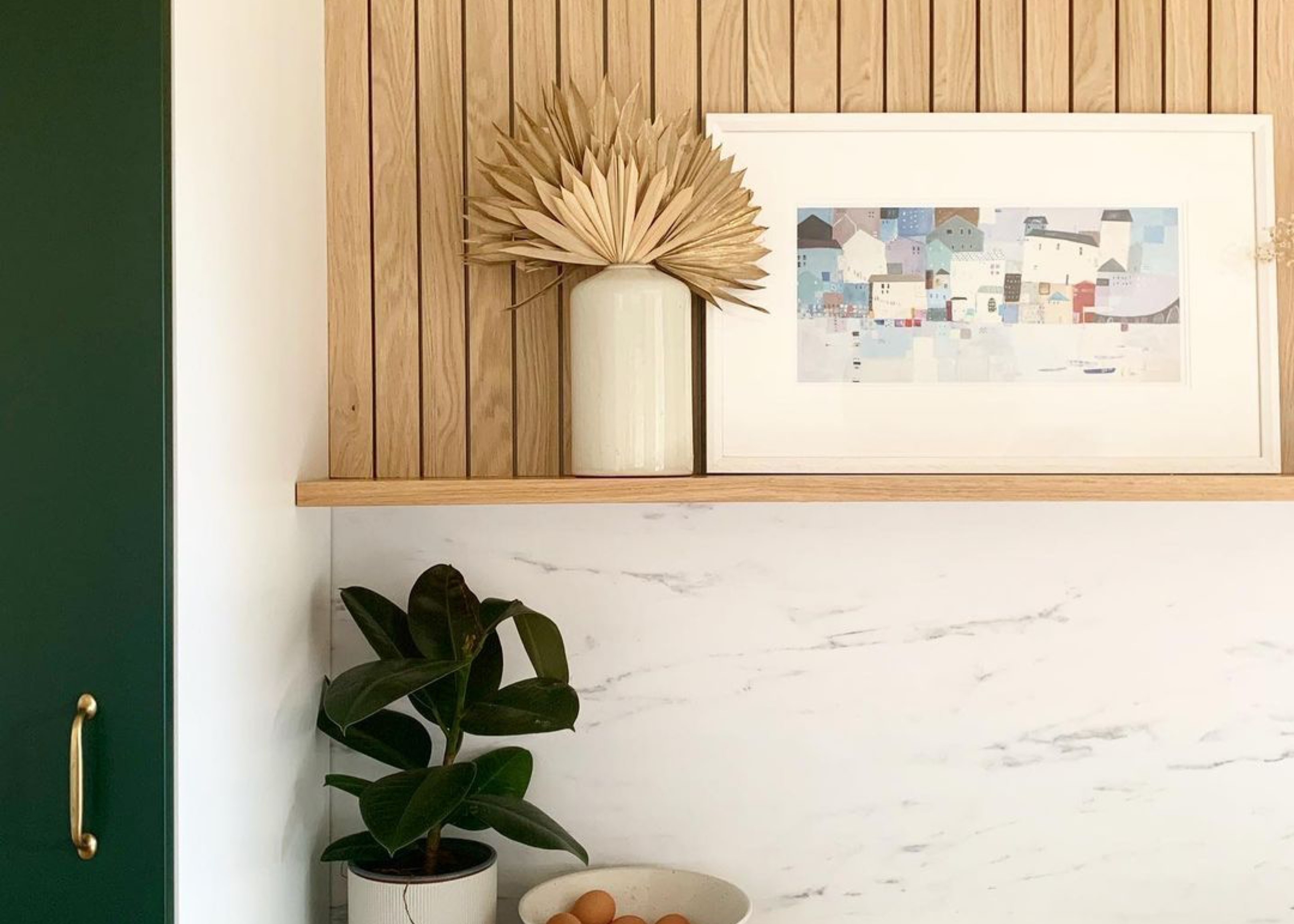 oak slat wall panel in kitchen