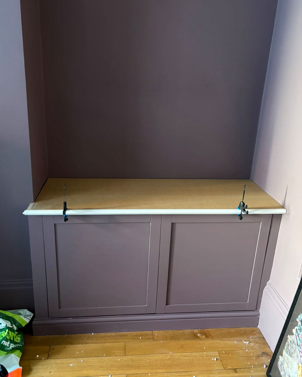 MDF top panel clamped onto IKEA Besta units before sanding and painting as part of the built-in alcove hack